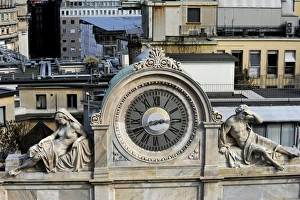 Italy. Milan. Clock decorated with two statues Italy. Milan. Clock decorated with two statues