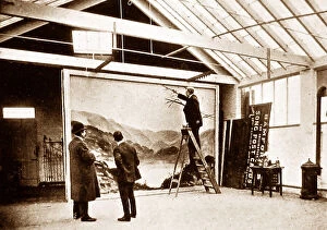 Related Images Collection: James Bamforth painting a backdrop at Bamforth's