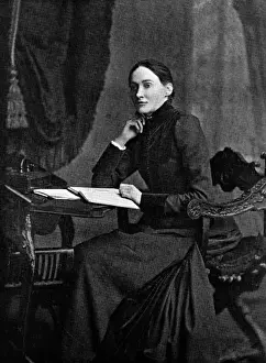 Jane Barlow at her writing table. Print of 1895