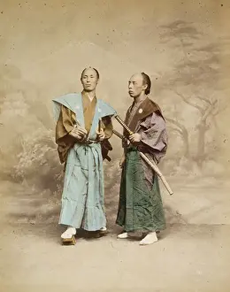 Prints of Two Japanese men, possibly samurai, full-length studio portrait with backdrop, standing, one facing front and the other facing left, each with two swords. Date ca. 1877 Japanese Samurai Armor Prints: Two Japanese Men, Full-Length Studio Print, ca. 1877