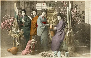 Four Japanese women amid bamboo with a young child Four Japanese women amid bamboo with a young child