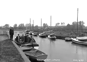 Prints of Kinnego Cut, Lurgan - a view of people in a boat by a pier. There are lots of other boats moored. (Location: Northern Ireland: County Armagh: Lurgan). Date: circa early 1900s Armagh Prints: Kinnego Cut, Lurgan Print - Early 1900s Scene