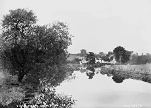 Prints of Lagan from Shaws Bridge - a view down the river taken from the bridge, there are houses in the distance. (Location: Northern Ireland: County Antrim: Belfast). Date: circa early 1900s River Prints: Early 20th Century Print of Lagan from Shaws Bridge, Belfast