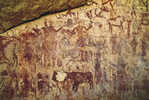 LIBYA. Tadrart Acacus. Depiction of a hunting scene LIBYA. Tadrart Acacus. Depiction of a hunting scene