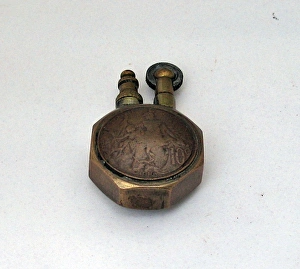 Lighter constructed from a large brass nut Lighter constructed from a large brass nut