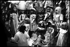 Little girl and dress and doll shop window Alexandria, Egypt Little girl and dress and doll shop window Alexandria, Egypt
