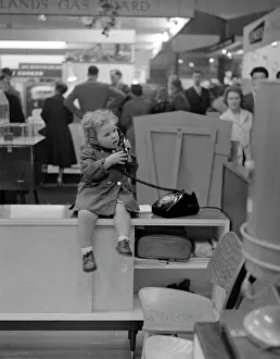 Little Girl on the phone at a Trade Show Little Girl on the phone at a Trade Show