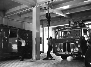 London firefighters sliding down a pole London firefighters sliding down a pole