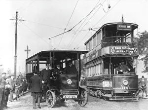 A London tram overtaking a trolleybus A London tram overtaking a trolleybus