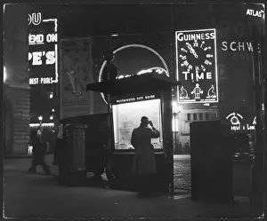 Piccadilly Circus At Night Prints: Man Studying Map