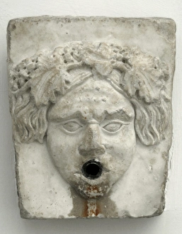 Marble fountain pipe. Dionysiac mask Marble fountain pipe. Dionysiac mask