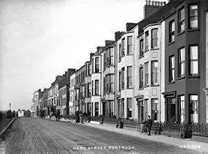 Prints of Mark Street, Portrush - a street scene showing boarding houses and horse vehicles and people. (Location: Northern Ireland: County Antrim: Portrush). Date: circa early 1900s County Antrim Prints: Early 20th Century Print of Portrush Street Scene