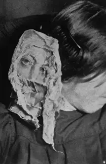 Prints of Marthe Beraud ( Eva C ) materialises a face at 33 rue George Sand, Paris, the home of Mme Bisson Date: 8 May 1912 George Sand Prints: Marthe Beraud (Eva C) Materialises a Face, Paris Print, 1912