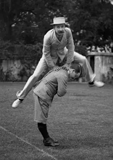 Print of Two Men Playing Leapfrog