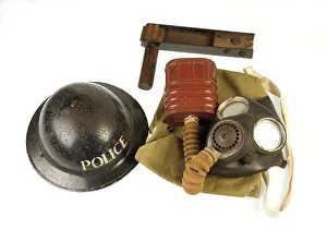 Metropolitan Police gas mask, bag, rattle and tin helmet Metropolitan Police gas mask, bag, rattle and tin helmet