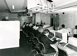 Prints of View of a Metropolitan Police operations room at New Scotland Yard, London, with officers and telephonists busy taking calls Police Prints: Metropolitan Police Operations Room Print, circa 1970s
