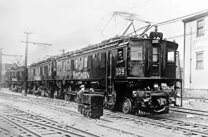 United States Railroad History Prints: The Midget and the Leviathan, small and large railway engine