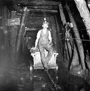 Miner riding drams, Tirpentwys Colliery, South Wales Miner riding drams, Tirpentwys Colliery, South Wales