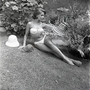 White Bikini Swimwear Prints: Model sunbathing in a white bikini