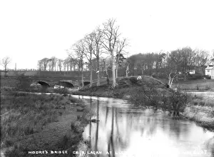 Prints of Moores Bridge on R. Lagan at Lisburn - a view of an old stone bridge on the river, there are buildings to the right. (Location: Northern Ireland; County Antrim; Lisburn). Date: circa early 1900s Lisburn Prints: Moores Bridge Print, Lisburn, Northern Ireland