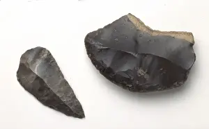 Prints of A slide scraper and a pointed tool made from black flint of Mousterian age, 40, 000 - 55, 000 years old (Middle Palaeolithic), from Le Moustier, France Flint Prints: Mousterian Tools Print: Le Moustier, France