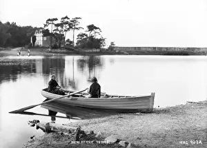 Prints of New Ferry, Toome - a view of two women in a boat at a short crossing point at the river. (Location: Northern Ireland: County Londonderry: Toomebridge). Date: circa early 1900s River Prints: Early 1900s Print of Women at Toome New Ferry Crossing