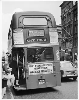 Prints of Passengers hop on the no.73 Routemaster bus to Kings Cross on the north side of Oxford Street Transport Prints: No. 73 Routemaster Bus Print