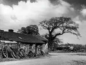 Prints of A picturesque old smithy (blacksmiths shop) at Northop, Flintshire, Wales. Date: 1930s Flintshire Prints: Northop Smithy Print, Flintshire, Wales, 1930s