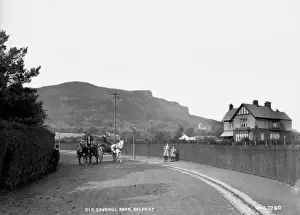Prints of Old Cavehill Road, Belfast - a view of two horse vehicles on the road and two girls to the right and a building, with the backdrop of Cavehill behind Belfast Prints: Early 20th Century Print of Old Cavehill Road, Belfast