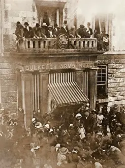 Prints of An opening custom of the Anglesey Hunt, whereby hot coppers or small change (heated in a bucket by the fire) are thrown from the balcony of the Bulkeley Arms Hotel following the hunt ball Anglesey Prints: Anglesey Hunt Opening Print: Hot Coppers Toss Tradition