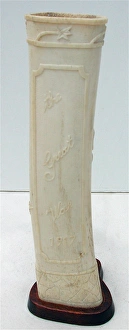 Pair of carved bone ornaments with raised foliate decoration Pair of carved bone ornaments with raised foliate decoration