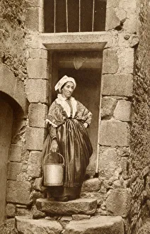 Peasant woman with pail, Auvergne, France Peasant woman with pail, Auvergne, France