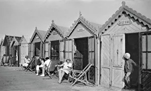 People outside beach huts, Cayeux, France People outside beach huts, Cayeux, France