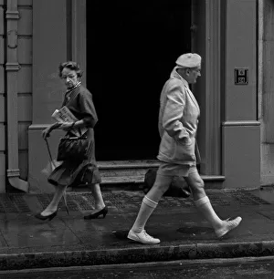 Two people pass each other in a London street Two people pass each other in a London street