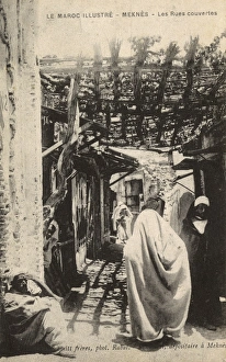 People in a shaded street, Meknes, Morocco People in a shaded street, Meknes, Morocco