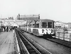 Prints of The electric train carries passengers to the end of the one and a half mile long pier, the longest in the world Essex Prints: Southend Pier Train Print
