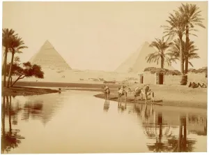 Prints of The Pyramids of Gizeh in Egypt, with water, trees, and camels in the foreground Place Prints: Print of the Pyramids of Gizeh with Camels