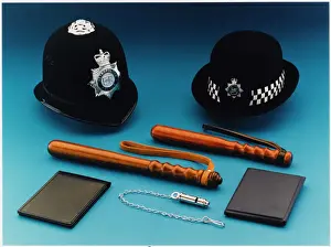 Prints of Selection of Metropolitan Police equipment including truncheons, helmets, notebooks and whistles Police Prints: Metropolitan Police Equipment Print