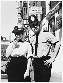 Prints of Police officers on the radio in the street in London. Metropolitan Police Police Prints: London Metropolitan Police Print