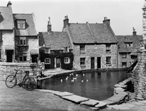 Prints of A lovely tranquil scene, with ducks on the old mill-pond in the charming village of Swanage, Dorset, England. Date: 1939 Dorset Prints: Mill Pond, Swanage 1939 Print