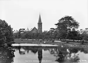 Prints of The Pond, Woodvale Park, Belfast - a view over the pond to the Church. (Location: Northern Ireland: County Antrim: Belfast). Date: circa early 1900s Belfast Prints: Early 20th Century Print of Woodvale Park, Belfast