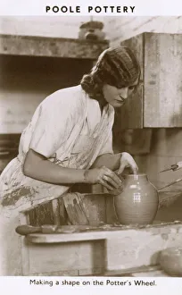 Poole Pottery - Shaping a pot on the potters wheel Poole Pottery - Shaping a pot on the potters wheel