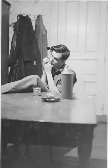 World War Two Historical Photos Prints: Private Tom Tedder playing the harmonica WW2