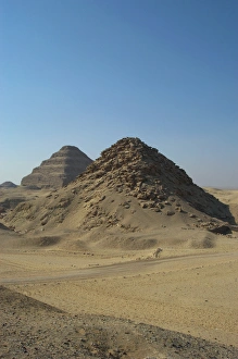 Pyramid of Userkaf. At background, Djoser Pyramid. Egypt Pyramid of Userkaf. At background, Djoser Pyramid. Egypt