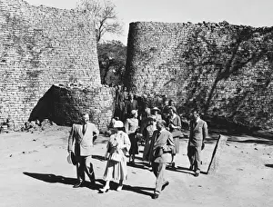 The Queen Mother Prints: Queen Mother Elizabeth Enters Zimbabwe Ruins Print