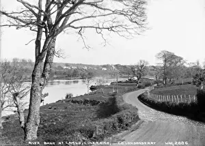 Prints of R. Bann at Camus, Coleraine, Co. Londonderry - a view over the river Bann with a road running alongside. On the river can be seen barges. (Location: Northern Ireland; County Londonderry; Coleraine) Map Prints: Early 20th Century Print of River Bann, Northern Ireland