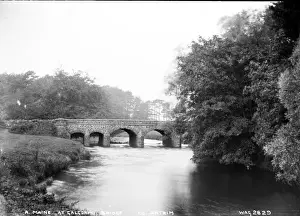 Prints of R. Maine at Galgorm Bridge, Co. Antrim - a view down the river to a stone bridge. (Location: Northern Ireland; County Antrim; Galgorm). Date: circa early 1900s River Prints: Early 20th Century Print of Galgorm Bridge, Co. Antrim