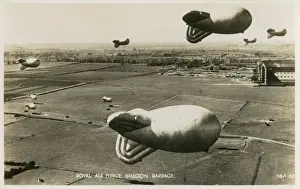 Prints of Royal Air Force Balloon Barrage at Cardington, Bedfordshire (note the distinctive airship hangars back right - still there today) Bedfordshire Prints: RAF Balloon Barrage at Cardington Print