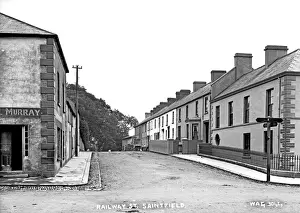 Prints of Railway St, Saintfield - a view of a deserted street. (Location: Northern Ireland; County Down; Saintfield). Date: circa early 1900s Down Prints: Early 20th Century Saintfield Railway Street Print