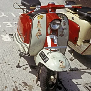 Red and white Lambretta with stickers Red and white Lambretta with stickers